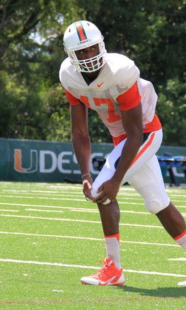 'Canes basketball player Raphael Akpejiori encouraged to give football a shot